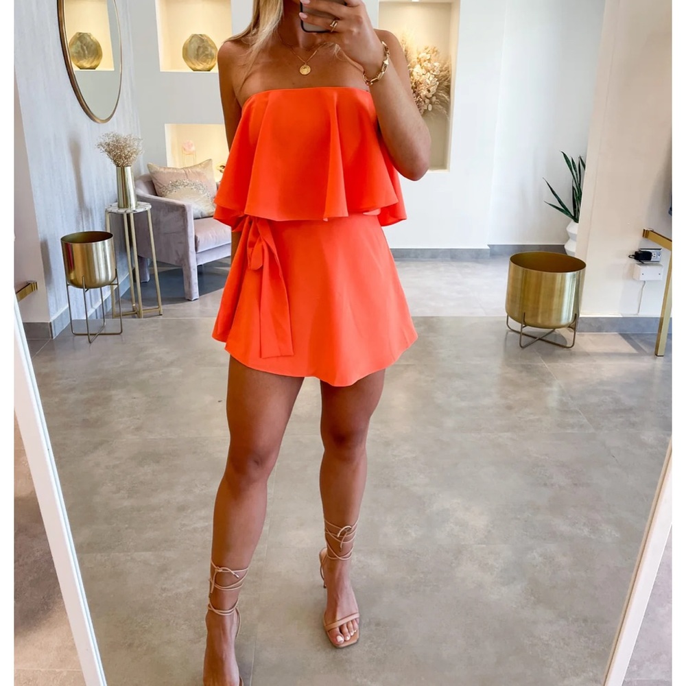 Self tie waist over flounce strapless romper